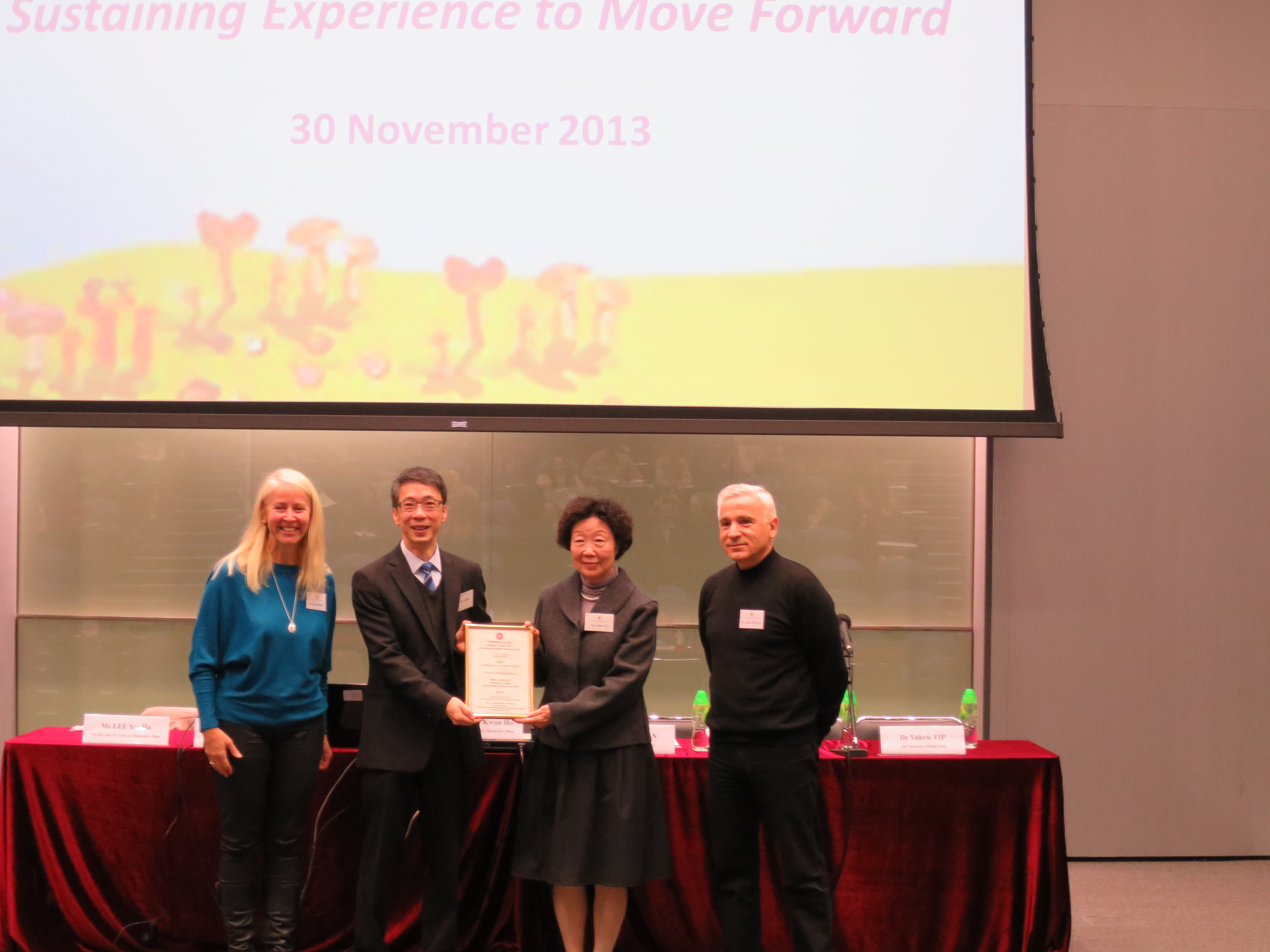 Presenting Certificate of Appreciation to The Hong Kong Polytechnic University (PolyU)